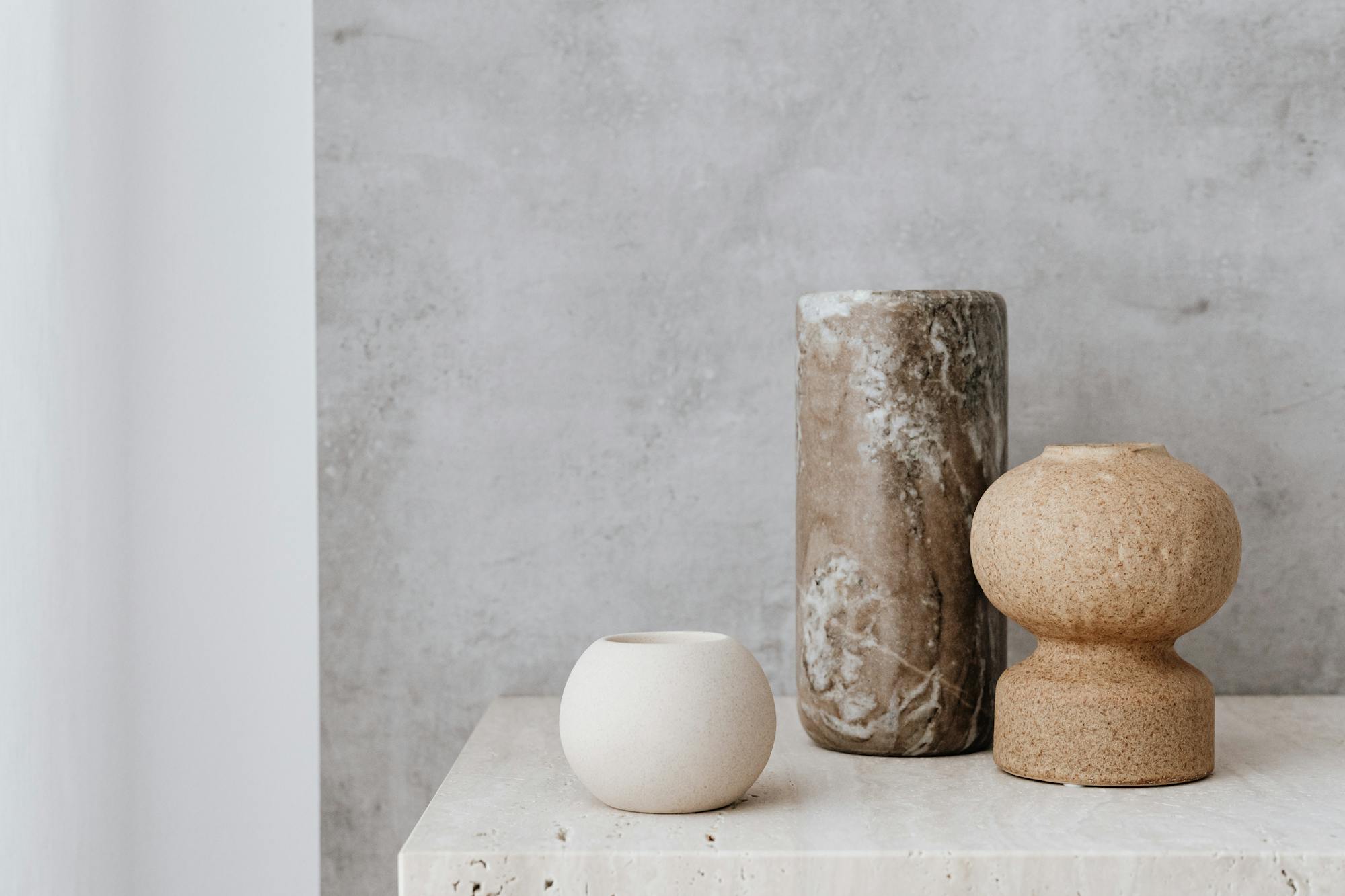 Three beautiful vases in creamy white and brown tones